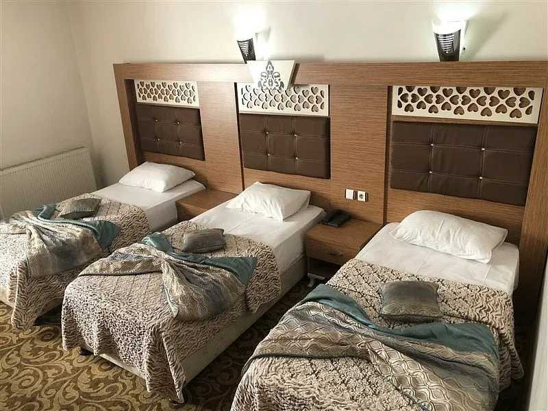 grand-milan-three-single-beds.webp
